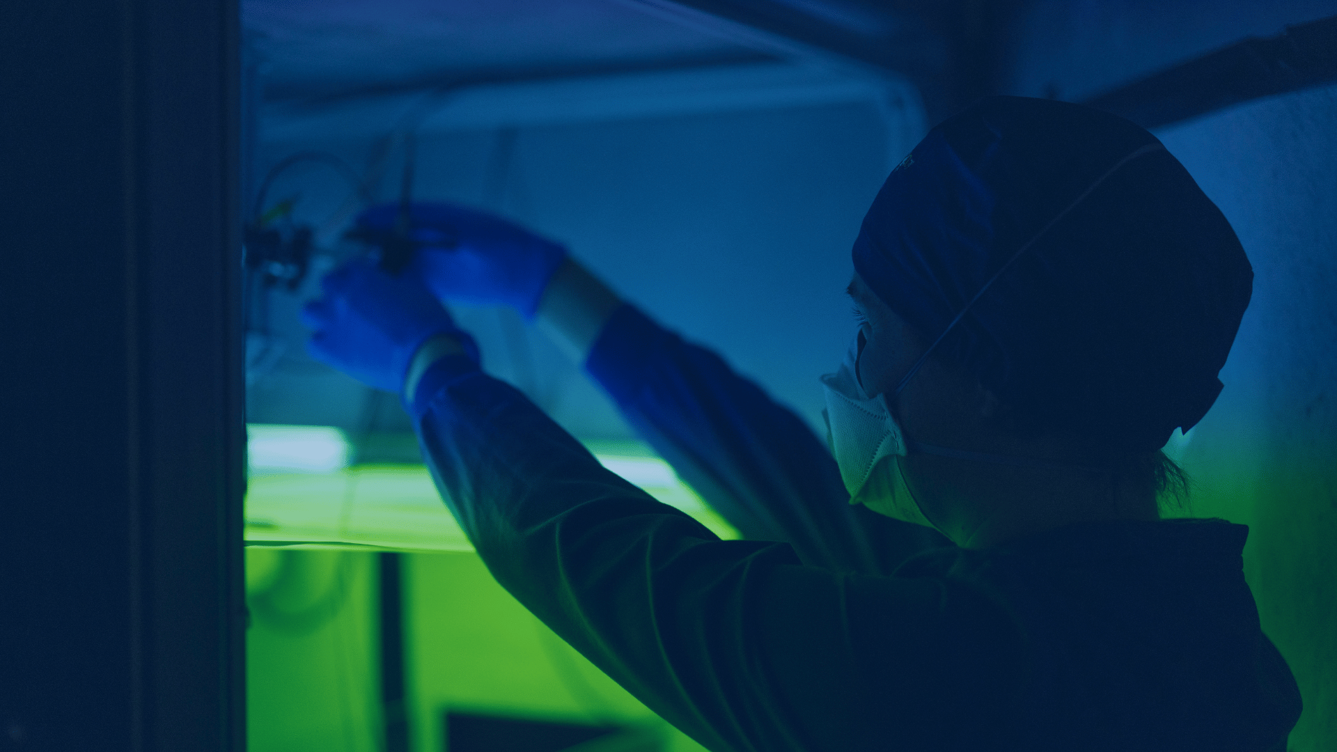 Scientist adjusting experimental set-up