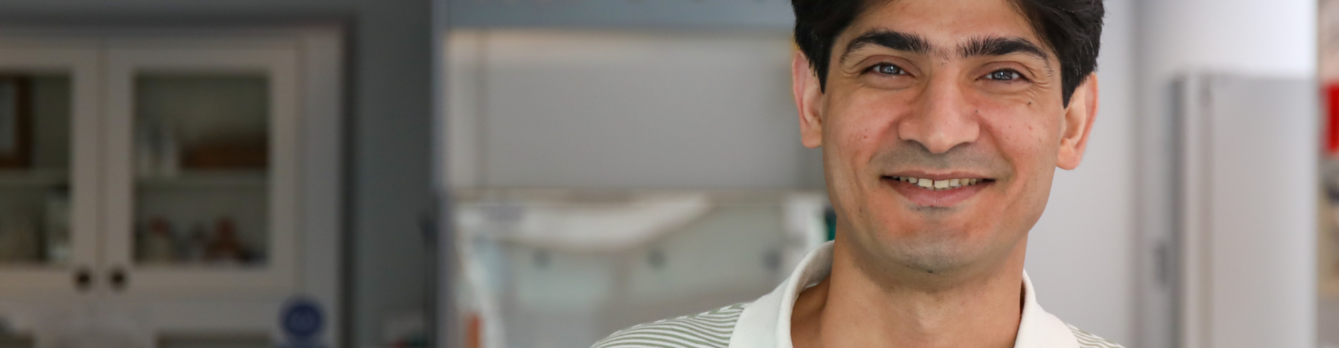 Photo of Dr Mehran Ahmadlou smiling in the lab at SWC