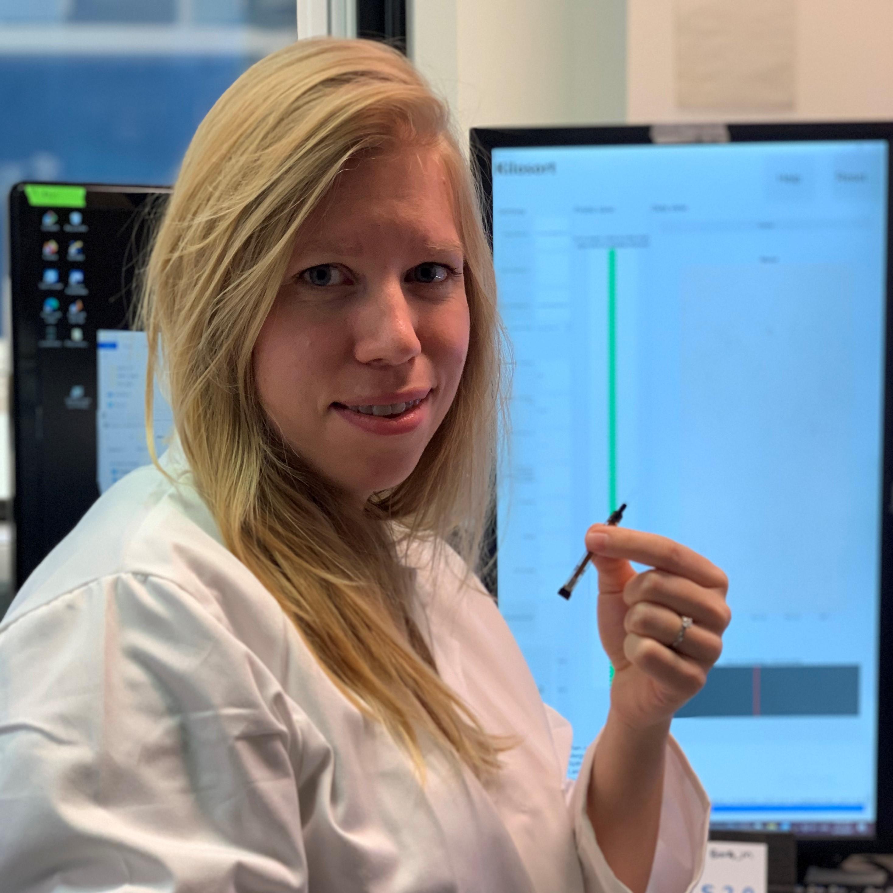 Anna Lebedeva holding a Neuropixels 2.0 probe