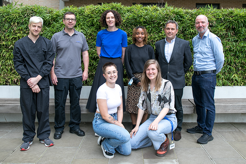 Group photo of SWC green team in SWC courtyard