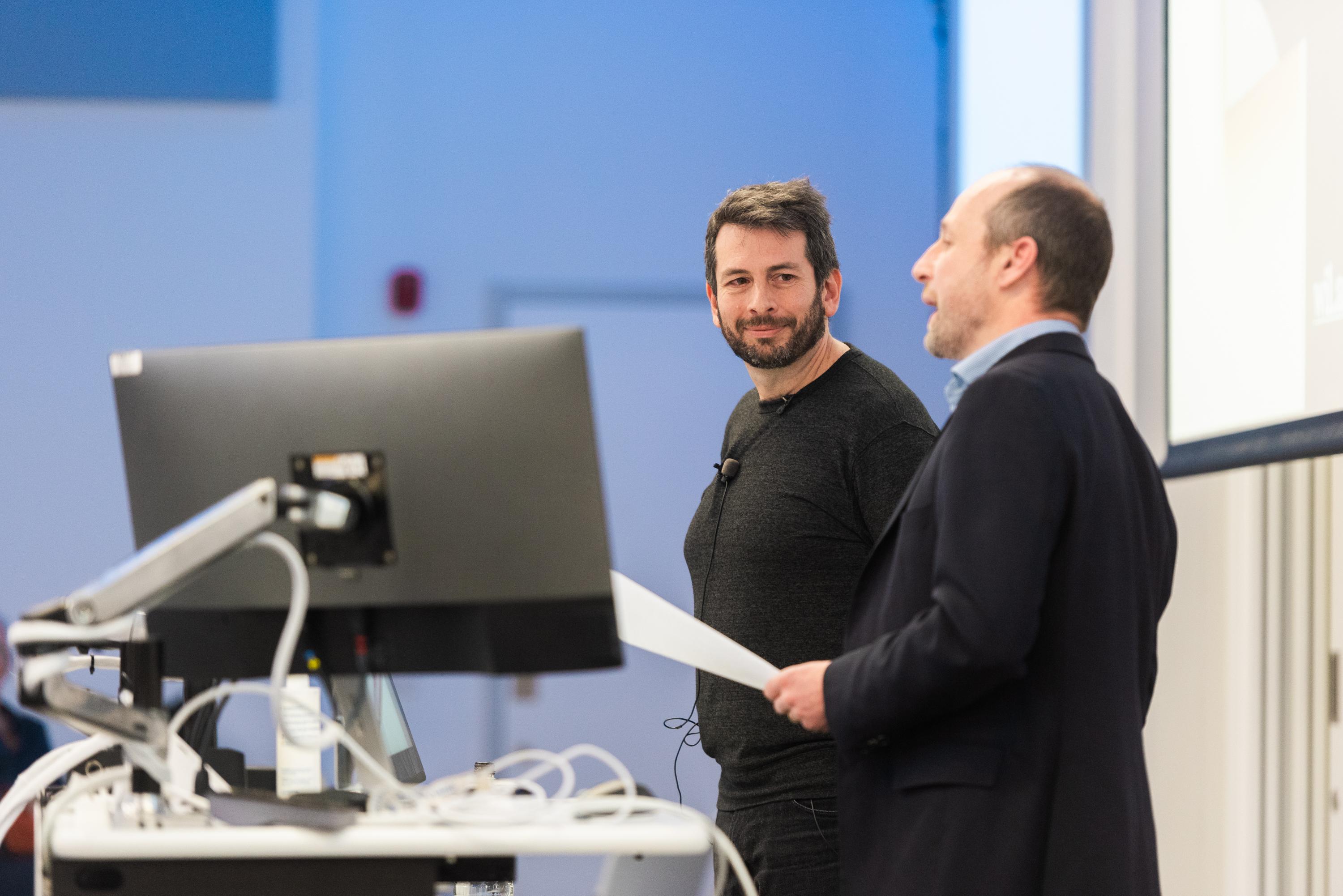 Blaise Agüera y Arcas and Tom Mrsic-Flogel at the SWC Lecture 2024. Photo by James Tye.
