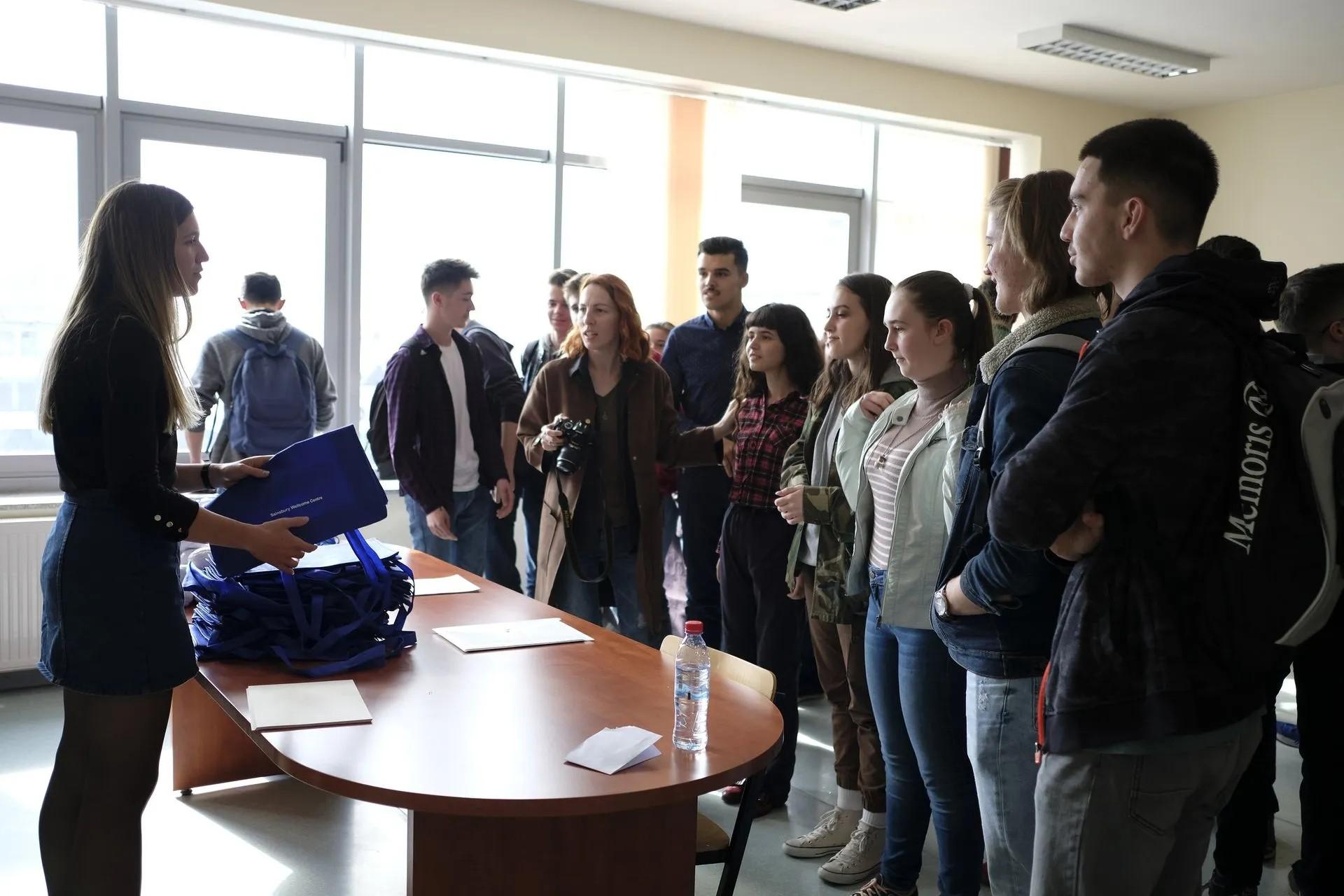 A photo of Egzona with BrainCamp Kosovo students