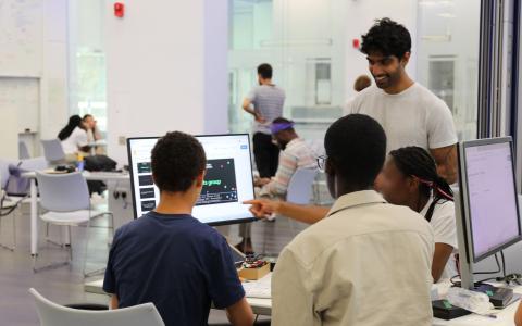 Jai Bhagat teaching three Neuronauts summer school students at SWC