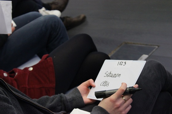 A contestant writes down answers to be displayed on the whiteboard during Brain Bee A contestant writes down answers to be displayed on the whiteboard during Brain Bee