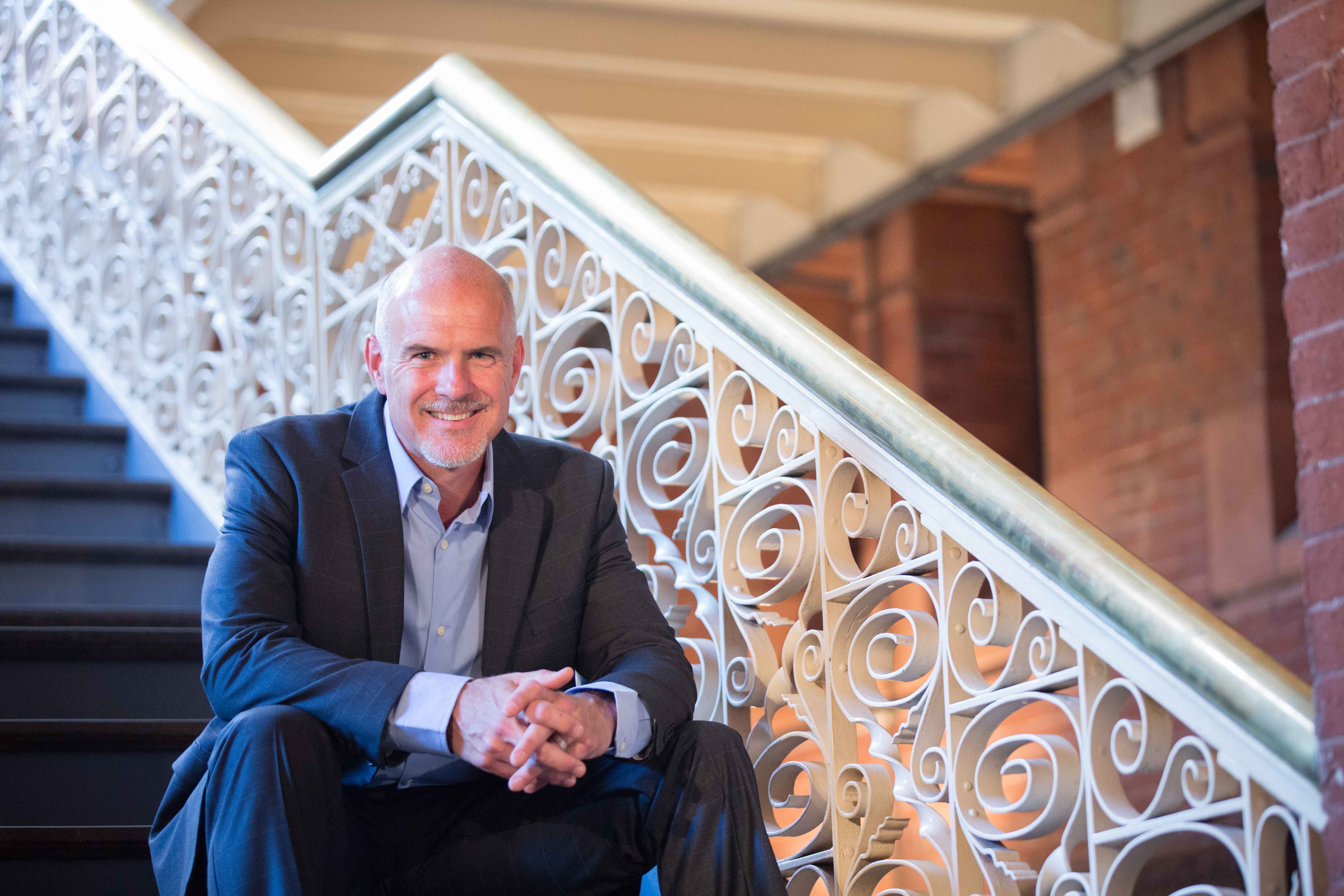 Michael Platt sitting on stairs