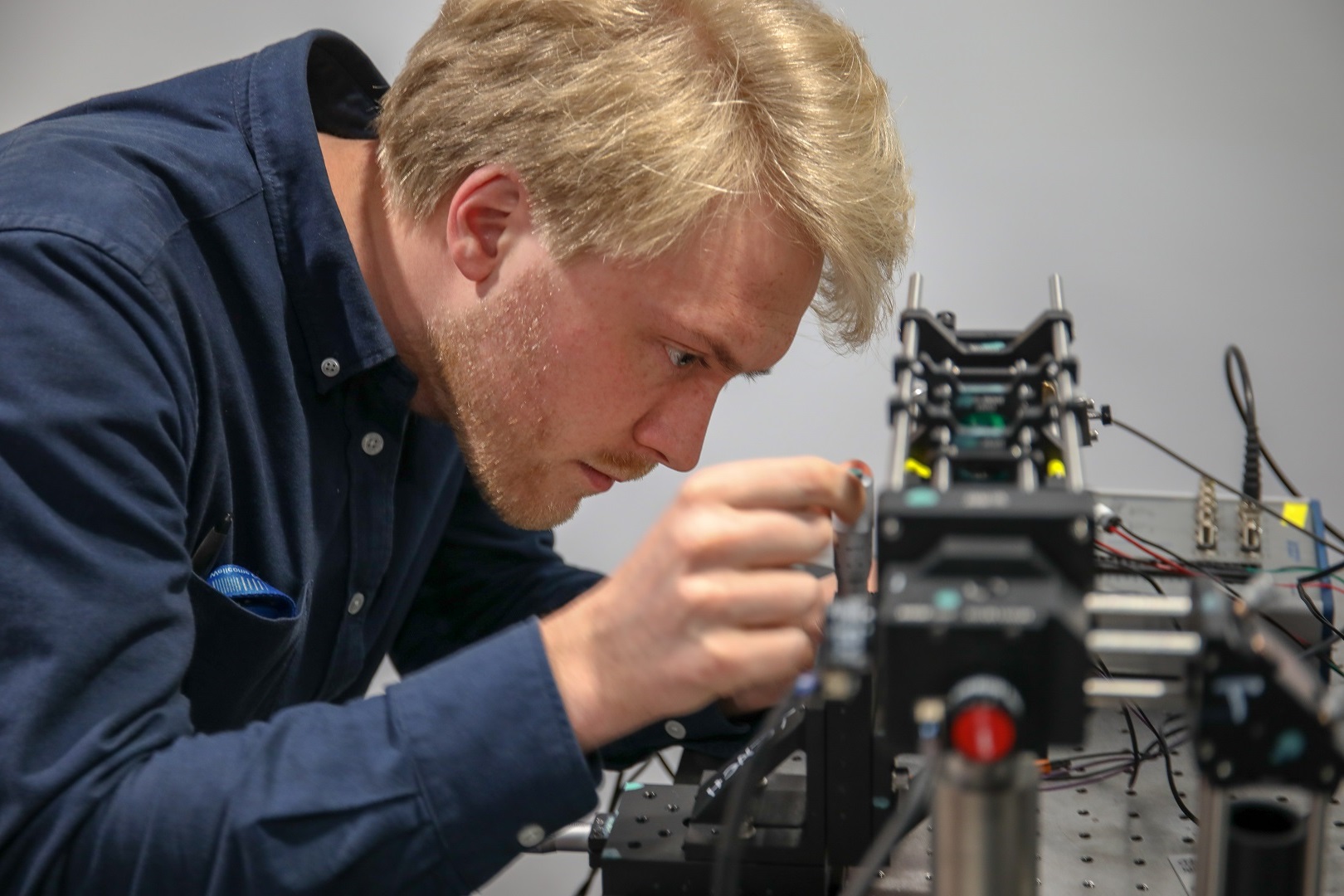 A student working on an optical setup