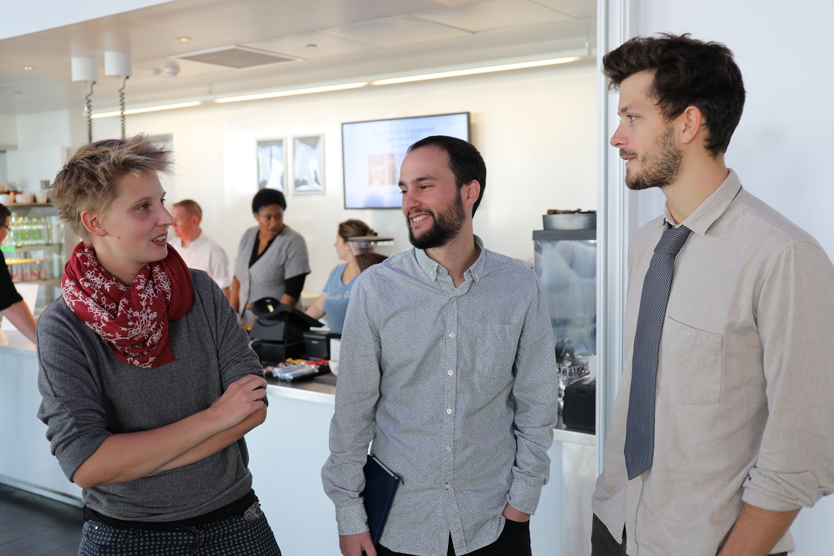 Photo of students from the Gatsby PhD programme, the Wellcome PhD programme in Neuroscience, and the Sainsbury Wellcome Centre Phd programme, socialising at an event.