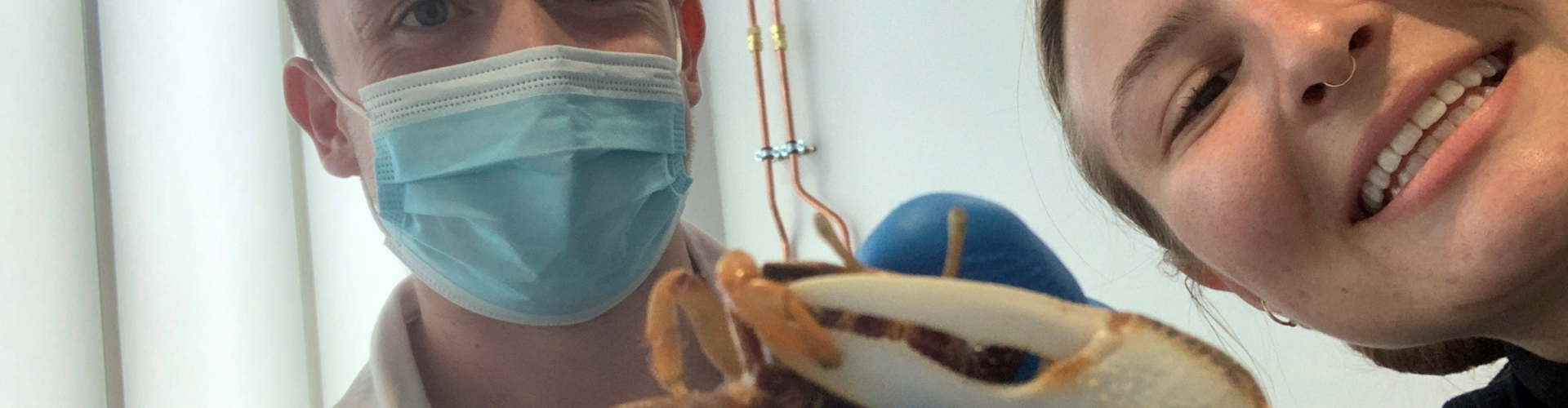 Benjamin Grainger and Sanna Titus holding a Fiddler crab