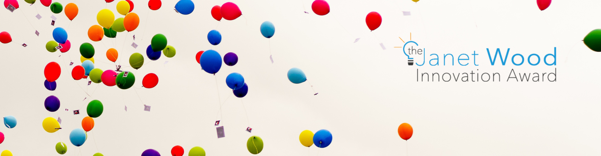 Celebratory balloons in the sky with Janet Wood Innovation Award logo overlaid