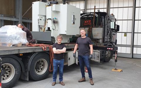 FabLabs engineers Del Halpin and Simon Townsend receive the new milling machine at the SWC